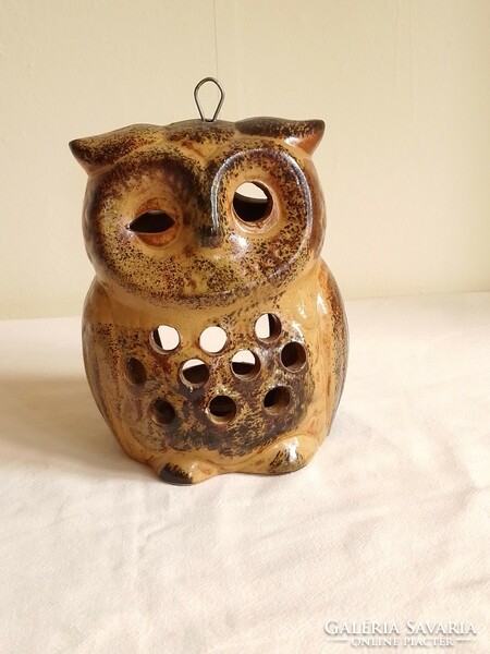 Old glazed ceramic candle holder, candle holder, in the shape of an owl figure, mood lighting