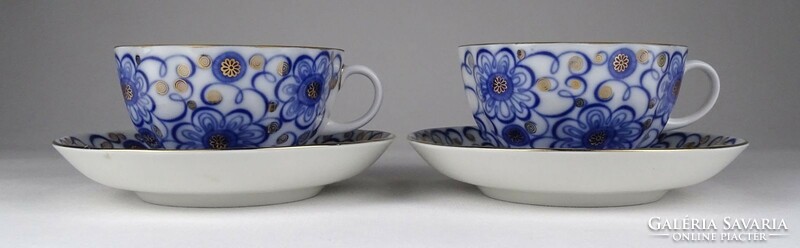 Pair of gilded St. Petersburg porcelain teacups marked 1Q981
