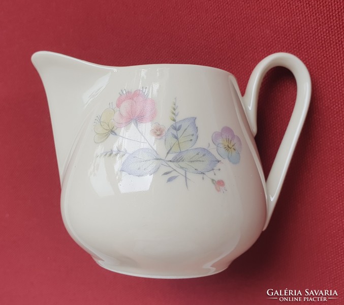 Porcelain pouring milk cream with flower pattern