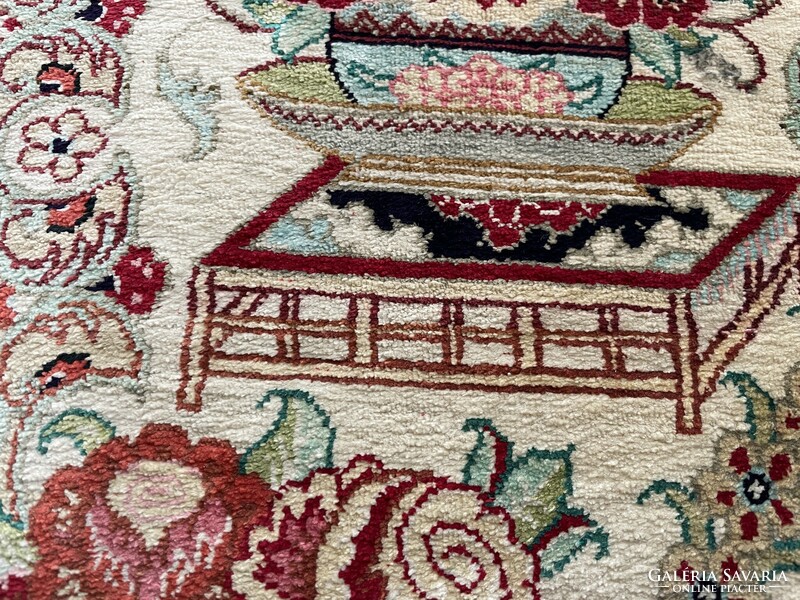 Ghom antique silk Persian rug with a bird motif