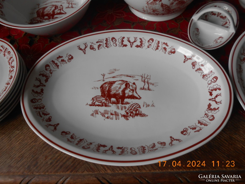 Zsolnay hunting scene tableware, in display case