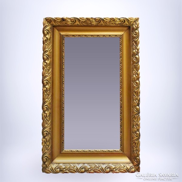 Classic framed wall mirror with gilded frame