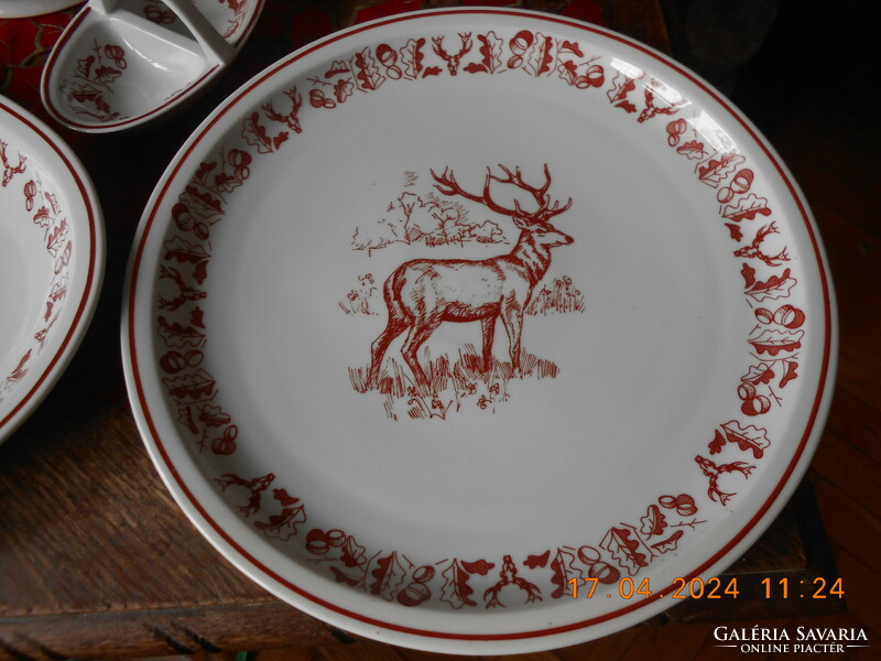 Zsolnay hunting scene tableware, in display case