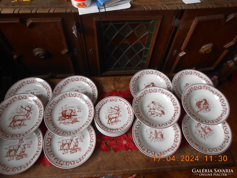 Zsolnay hunting scene tableware, in display case