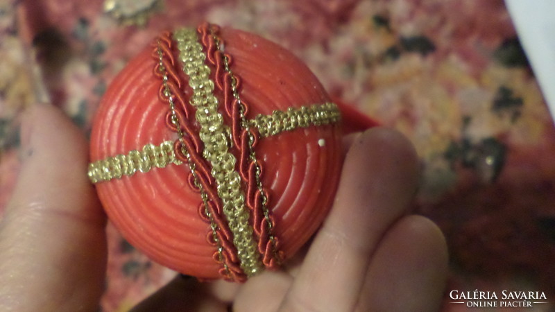 Retro Christmas tree decoration. Covered with wax, decorated with textile flowers and cords.