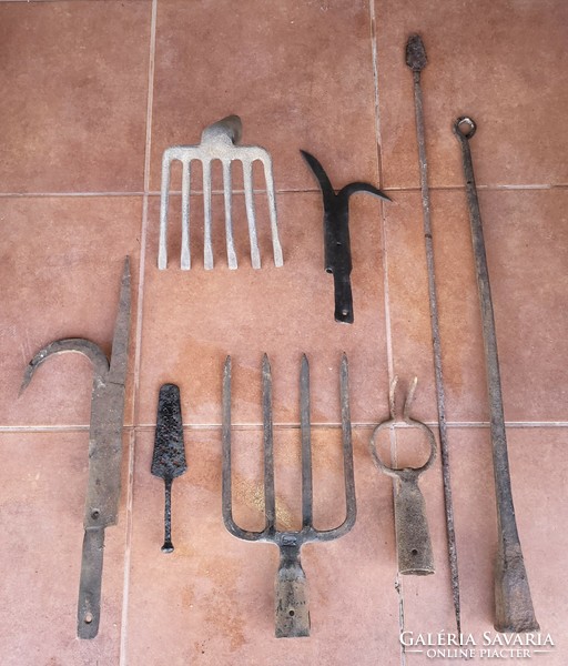 Wrought iron tools, spade fork, pickaxe, scythe anvil, etc.