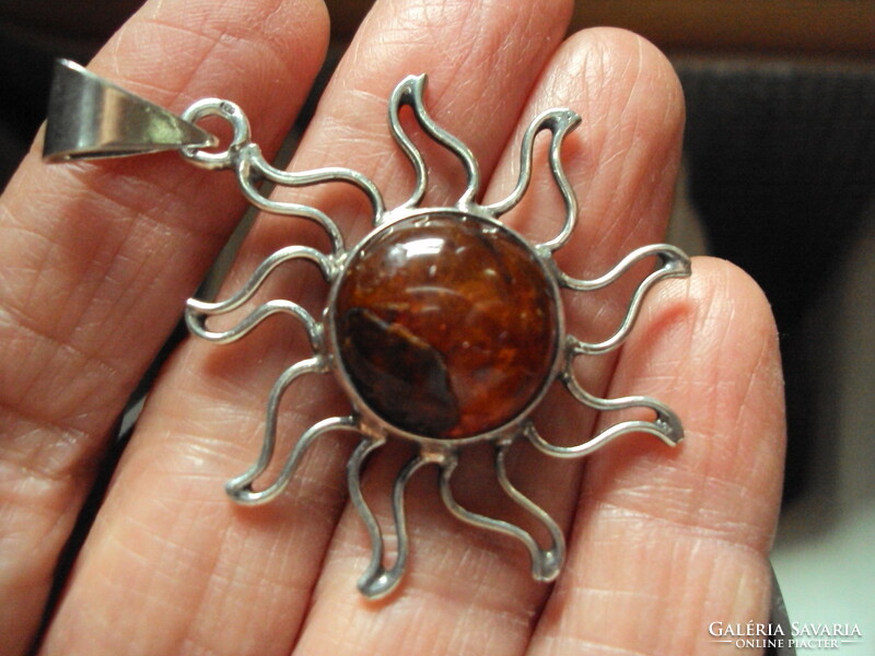 Silver pendant with amber