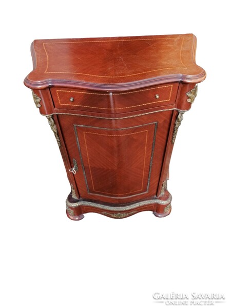 Inlaid chest of drawers with copper applications