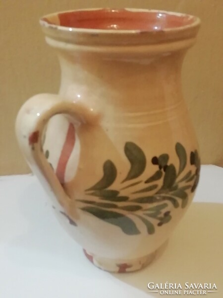 Old beige jug, straw