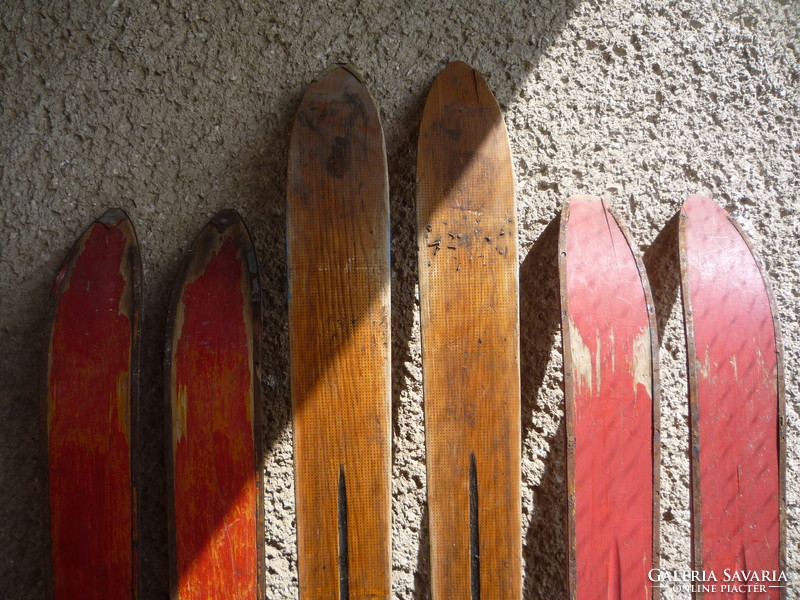 Old wooden skis, poles.