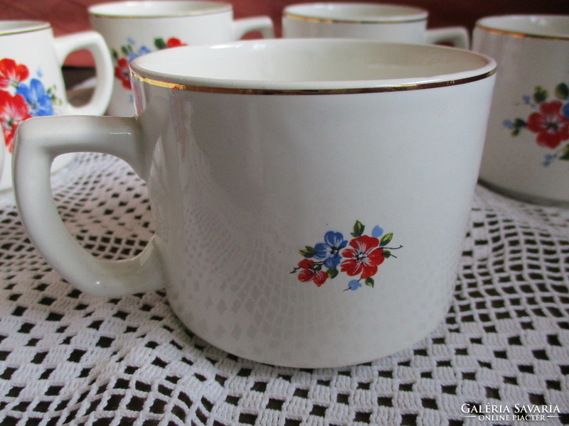 Granite cups with poppies and wildflowers