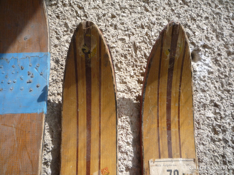 Old wooden skis, poles.