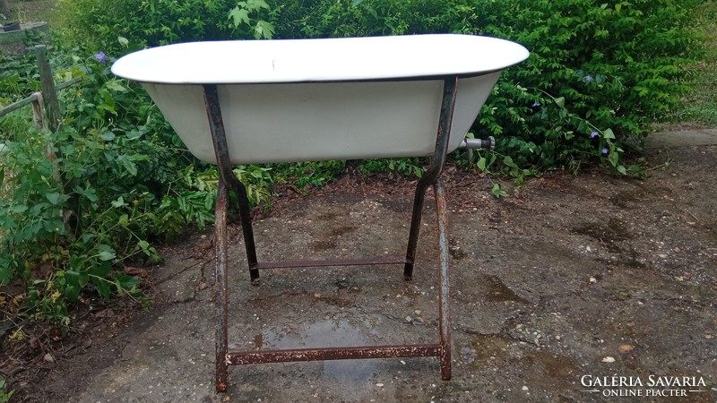 2 enamel baby bathtubs - one lampart and one stone mine - for sale together with a stand