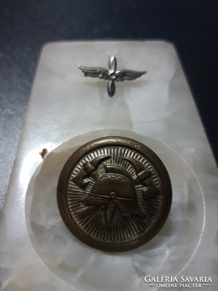 Old fireman's button and aviator's badge