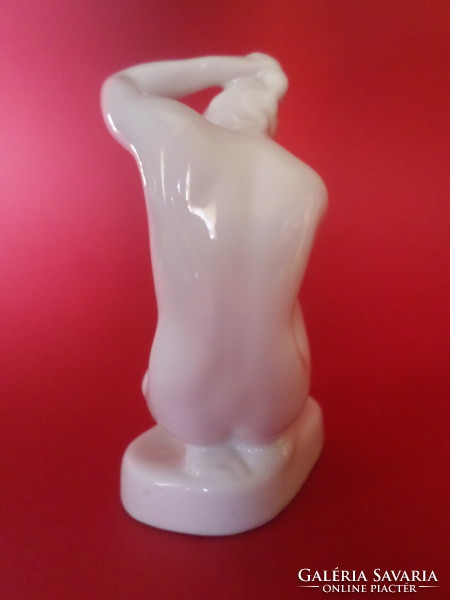 Aquincum porcelain kneeling female nude figure