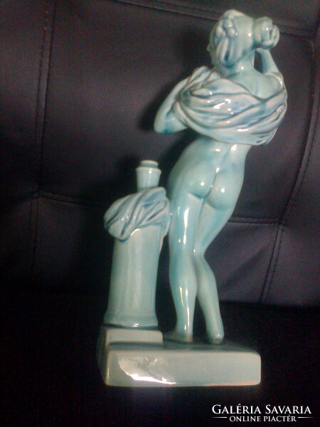 Zsolnay: undressing woman next to a vase