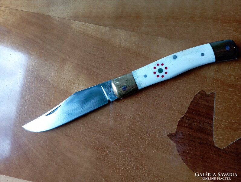 Nagymaskara traditional Hungarian knife with a polished antler handle, decorated with a cockade in the national color.