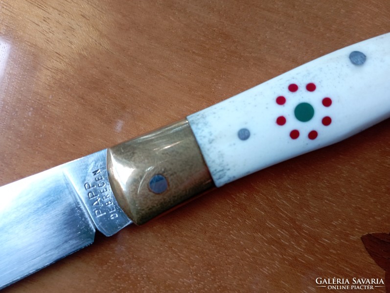 Nagymaskara traditional Hungarian knife with a polished antler handle, decorated with a cockade in the national color.