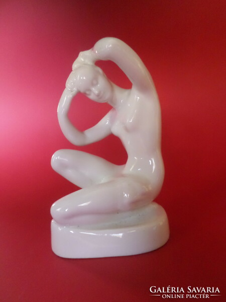 Aquincum porcelain kneeling female nude figure