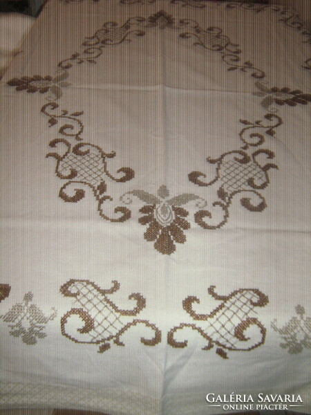 Beautiful hand-embroidered woven tablecloth with a baroque pattern