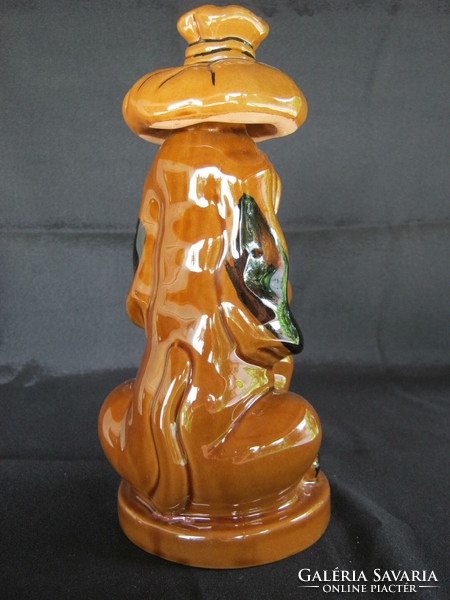 Fun ceramic dog bottle pouring drink offering brandy