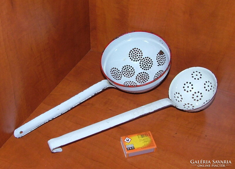 2 old white enameled metal filters with handles.