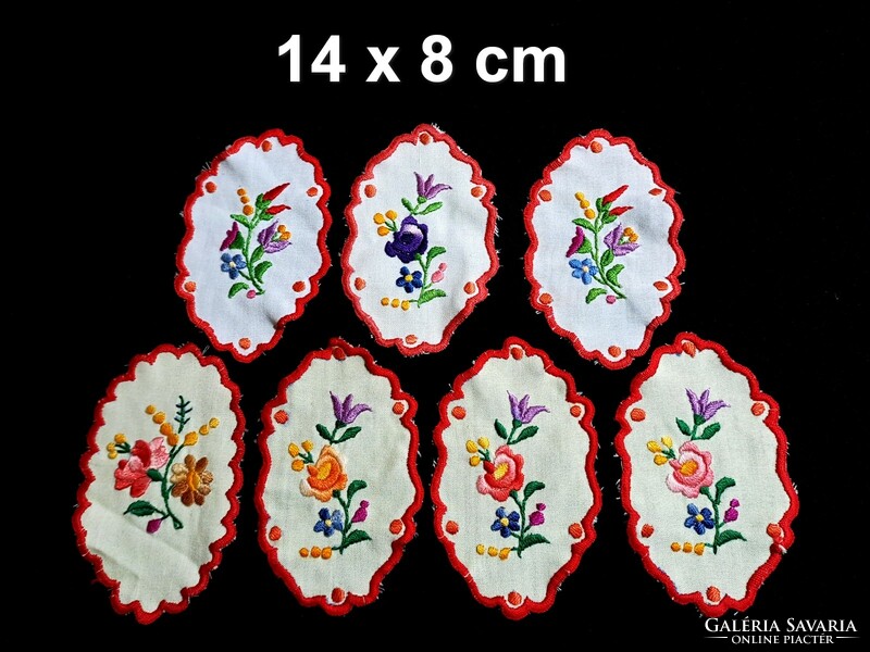 7 Oval tablecloths embroidered with Kalocsa patterns, 14 x 8 cm