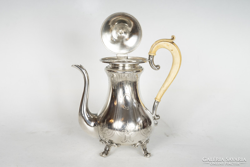 Silver jug with finely chiseled decoration