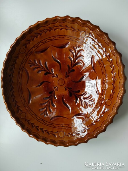 Brown glazed folk ceramic wall bowl