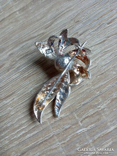 Silver flower-shaped brooch