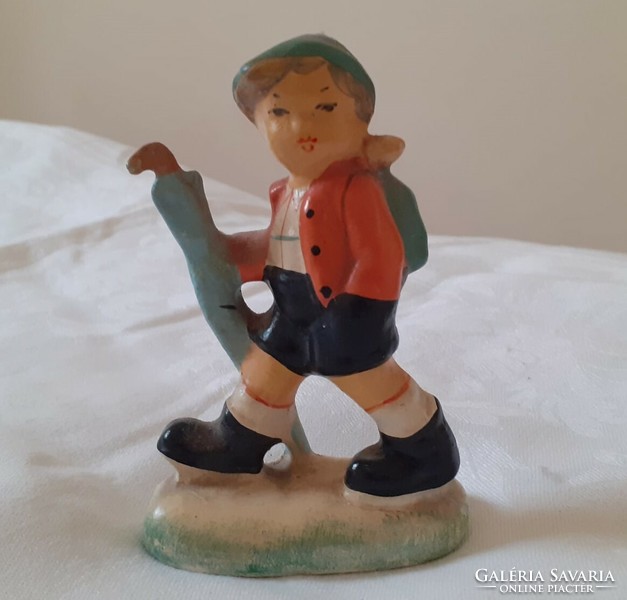 Ceramic figurine of a boy with an umbrella (unmarked)