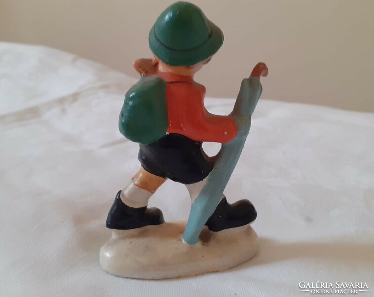 Ceramic figurine of a boy with an umbrella (unmarked)