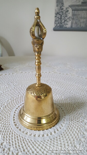 Brass hand bell, bell with face/head and crown handle