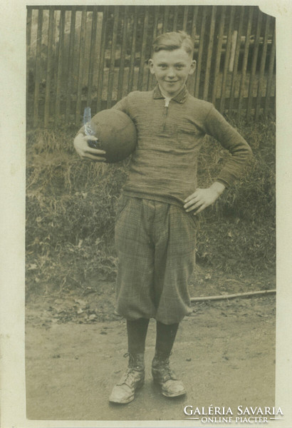 1930s. Germany. Little boy with soccer ball. Original paper image, old postcard, photo sheet.