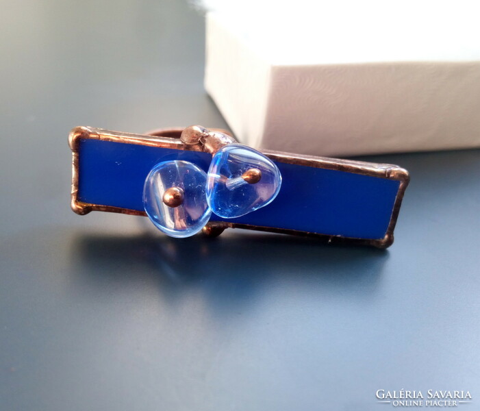 A special, large ring with royal blue glass and pearls