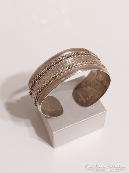Thick ornate silver bracelet