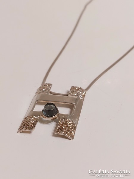 Special square pendant with pale blue stone