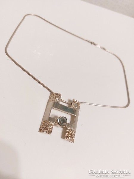 Special square pendant with pale blue stone