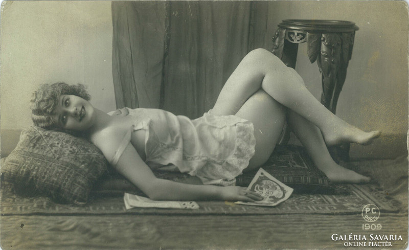 1909. Erotic photo of a young woman. Original paper image. Old photo. Black and white photo sheet, postcard.