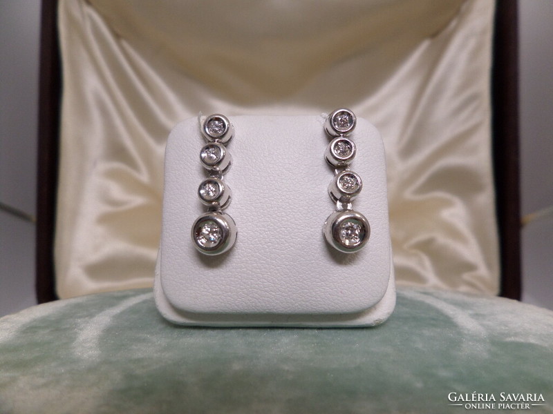 A pair of white gold modern brillar earrings