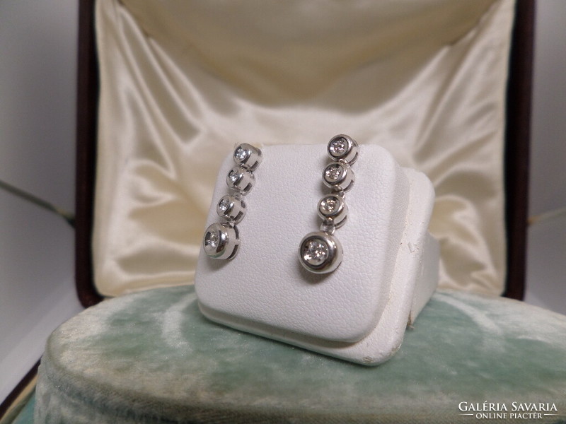 A pair of white gold modern brillar earrings