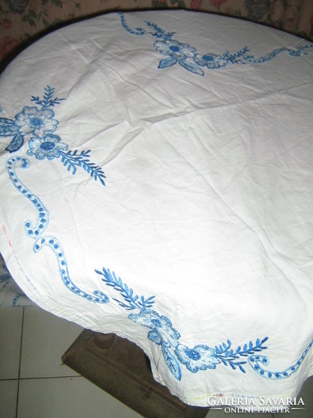 Beautiful vintage tablecloth embroidered with blue flowers