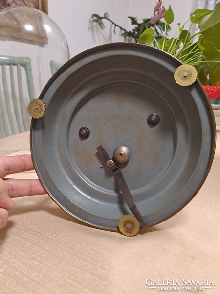 A beautiful table clock with a rotating pendulum