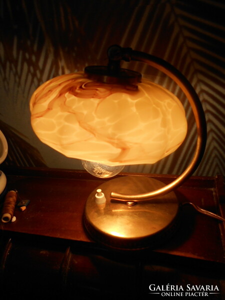 Table lamp with a glass shade with a marble pattern