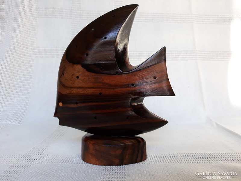 Art deco style fish carved from tropical wood
