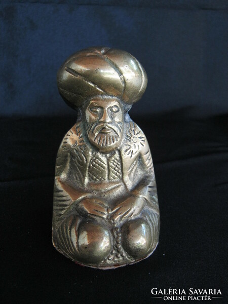 Copper figure of a praying man