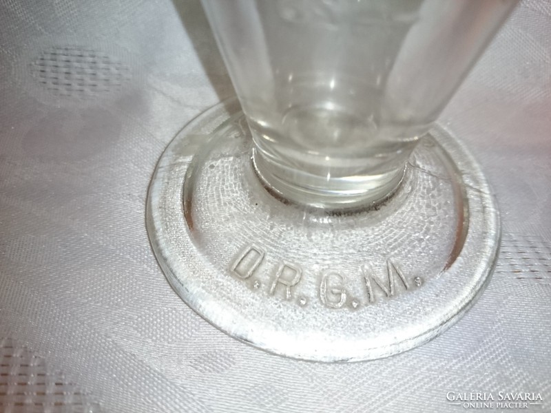 D.R.G.M. Thick-walled glass measuring vessel with a handle. Made of 195O