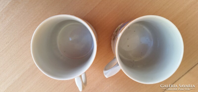 A pair of old poppy Zsolnay mugs