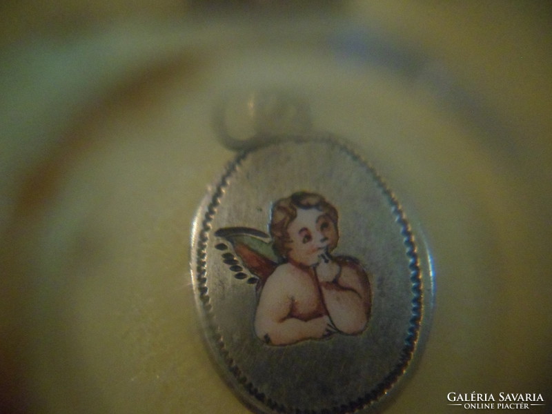 Antique silver putto pendant