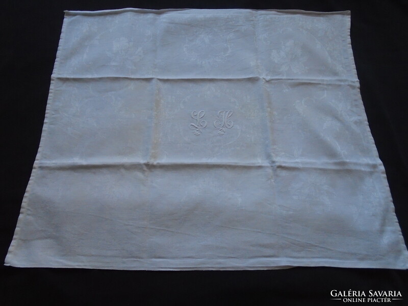 Iridescent, monogrammed damask napkin, tablecloth 79 x 67 cm.